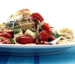 FG0000849-01 FOR EDITORIAL USE ONLY. NOT FOR SALE IN SOUTH AFRICA. Dinner Sorted. Tomato and feta pasta with fresh parsley. Ingredients: 500 g cherry tomatoes, 3 garlic cloves, crushed, 1 chili (optional), 100 ml olive oil, Salt, black pepper and sugar, 2 blocks feta, 500 g spaghetti or linguini, Large handful parsley leaves, chopped Grated parmesan cheese and roasted pine seeds. Method: Cook the pasta according to instructions on packet. Heat the olive oil in a large pan and fry the cherry tomatoes in it until they start to pop open. Squeeze a few of the tomatoes (to make a sauce). Add the garlic and flavour with salt, pepper and sugar. Add the feta and parsley. Drain the pasta and mix in the sauce. Sprinkle the grated parmesan cheese and roasted pine nuts over the pasta (if desired) and serve. Serves 6.RECIPE AVAILABLE. Obligatory credit - CAMERA PRESS / Gallo Images / Landbouweekblad